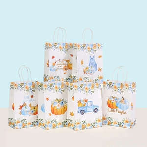 Detail of Little Pumpkin gift bags with gold foil accents and blue car motifs