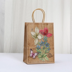 Brown kraft paper gift bag with floral print and rope handles for party shopping