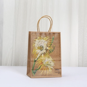 Vintage kraft paper gift bag with floral prints and durable rope handles for parties