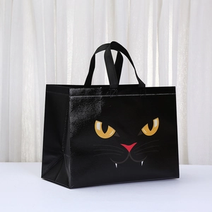 Halloween black non-woven shopping bag featuring a cute cartoon cat face with yellow eyes