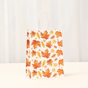Kraft paper Thanksgiving gift bag with autumn maple leaves and sturdy white rope handles