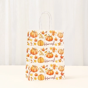 Detail of Harvest pumpkin print on Thanksgiving kraft paper gift bag with rope handles