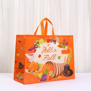 Orange non-woven shopping bag featuring Hello Fall pumpkin and turkey print patterns