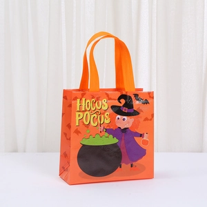 Close-up of orange non-woven Halloween gift bag with witch and Hocus Pocus print