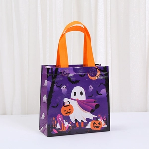 Detail of Halloween non-woven gift bag with purple ghost and pumpkin print patterns