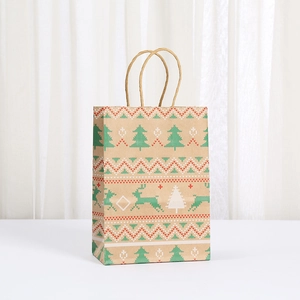 Christmas kraft paper gift bag with reindeer and tree prints and sturdy rope handles