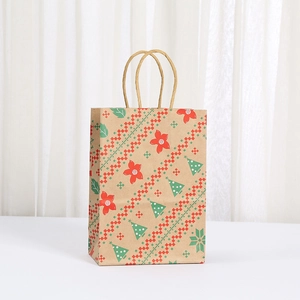 Brown kraft paper Christmas gift bag with festive holiday tree and snowflake patterns