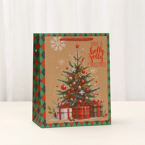 Christmas Kraft paper gift bag featuring festive tree print and red woven handles