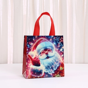 Christmas non-woven gift bag with colorful Santa Claus print and red ribbon handles