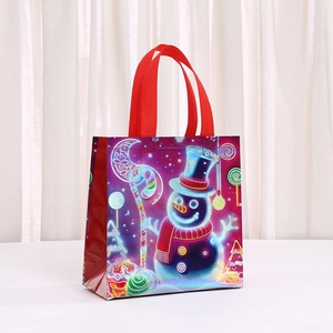 Christmas non-woven gift bag with neon snowman print and sturdy red ribbon handles