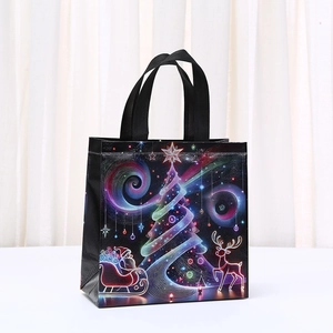 Black Christmas non-woven gift bag with neon Santa Claus and reindeer festive print