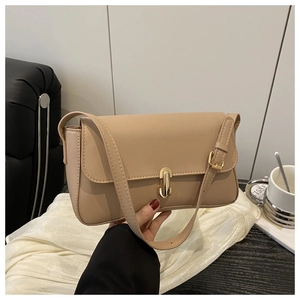 Close-up of the elegant apricot PU leather shoulder bag featuring a gold metal buckle