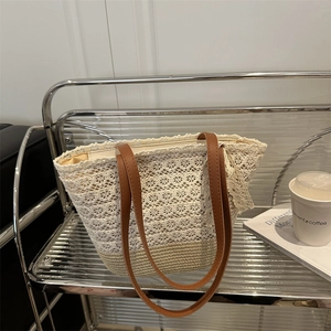 Lace woven beach tote bag with brown straps for summer seaside vacation and daily use