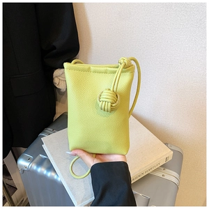 Detailed view of lime green lychee grain leather mini crossbody phone bag for women
