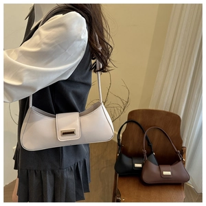 Chic French baguette shoulder bag shown in beige, black and brown leather options