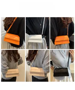 Multi-color view of rectangular flap crossbody bags in orange, white, beige, and black