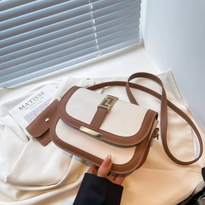 Two-piece saddle bag set in cream and brown PU leather with geometric metal clasp
