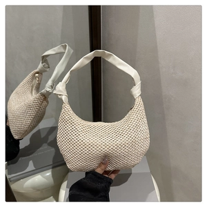 Close-up of beige woven hobo bag with knotted PU shoulder strap and zipper detail