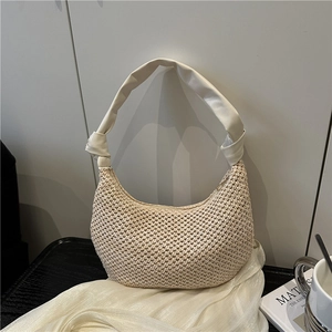 Beige woven hobo shoulder bag with knotted faux leather strap for summer beach travel