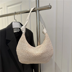 Chic beige woven hobo shoulder bag with white leather knotted strap in crescent shape