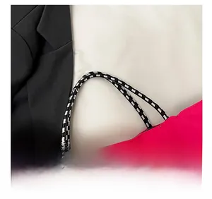 Detail of the woven rope handle on a pink tote bag with high-quality fabric texture