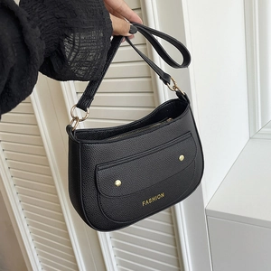 Black pebble leather crescent shoulder bag with gold fashion text and hardware for women