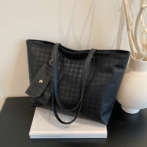 Chic black houndstooth embossed tote bag with a mini envelope pouch and long straps