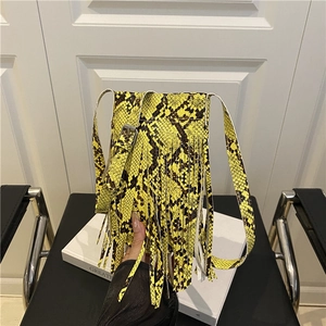 Mini crossbody bag with vibrant yellow snakeskin print and long fringe tassel detail