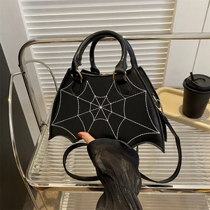 Gothic black bat wing handbag with white spider web stitching and adjustable strap