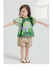 Detail of girls' cotton linen summer set featuring ruffe sleeves and khaki puff shorts