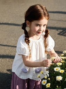 Girls summer two-piece outfit featuring white heart short sleeve shirt and purple pants