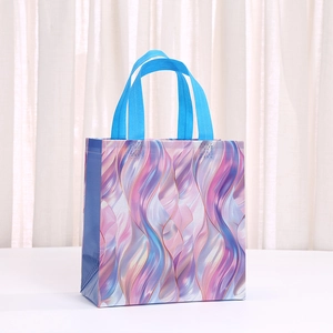 Vibrant iridescent shell print non-woven gift bag with blue handles for party favors