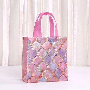 Elegant shell pearl gift bag with gold ogee patterns and pink ribbon handles