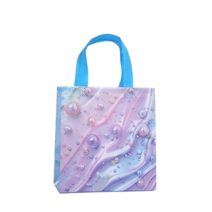 Chic iridescent shell pearl printed non-woven gift bag with blue handles on white background