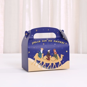 Detail of blue Reyes Magos gift box with handle and festive star desert illustration