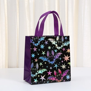 Purple Halloween non-woven gift bag with laser bat and star patterns and sturdy handles