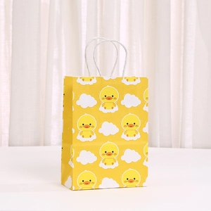 Cute cartoon duck printed yellow kraft paper gift bag with white twisted rope handles