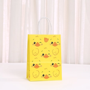 Yellow kraft paper gift bag with cute cartoon duck print and white rope handles