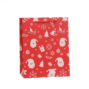 Red Christmas Santa Claus kraft paper gift bag with snowflakes and red rope handle