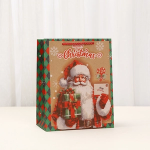 Vintage Christmas kraft paper gift bag featuring Santa Claus and red rope handles