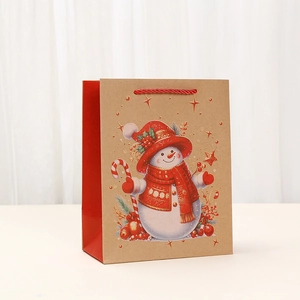 Brown kraft paper Christmas gift bag with festive snowman illustration and red handle