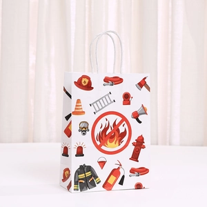Detail of firefighter themed paper gift bag with red fire engine icons and white handles
