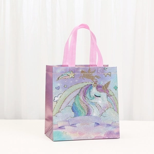 Holographic unicorn non-woven gift bag with rainbow prints and pink handles