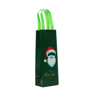 Green non-woven Christmas wine gift bag with Santa Claus print and sturdy handles