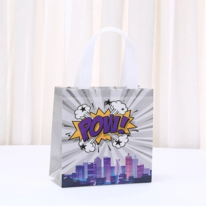 Silver non-woven gift bag with comic POW! design and city silhouette for parties