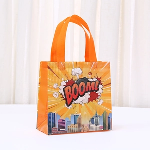 Comic style City Hero gift bag with orange handles and BOOM graphic for party favors