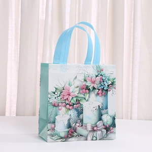 Cartoon Christmas non-woven gift bag with festive winter illustration and fabric handles