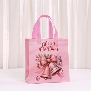 Pink non-woven Christmas gift bag with Merry Christmas print and festive illustrations