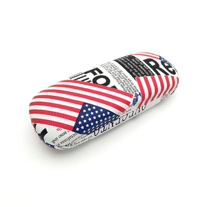 Hard shell eyewear case featuring vintage newspaper print and American flag pattern