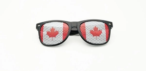 Detail view of Wellington party sunglasses with Canada flag mesh printed lenses and black frame